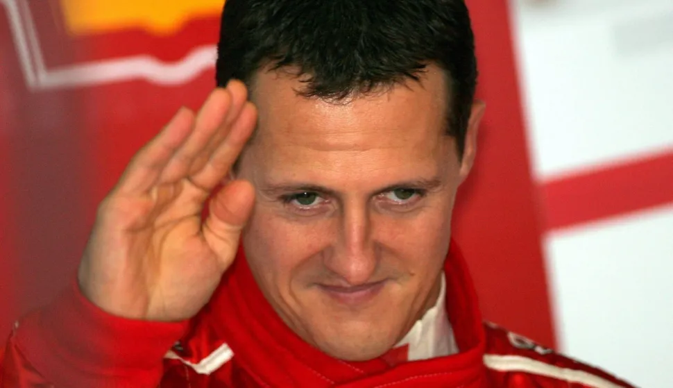 epa00834608 German Formula One driver Michael Schumacher of Scuderia Ferrari F1 Team gestures during the second practice session at the Japanese racetrack in Suzuka, Japan, Friday 06 October 2006. The Japanese F1 Grand Prix will take place here on Sunday 08 October. EPA/Carmen Jaspersen