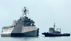 The US Navy's USS Cincinnati (LCS-20) littoral combat ship (L) arrives for a port call at the Ream Naval base, located in Cambodia's southern coast in Preah Sihanouk province, on January 24, 2026. (Photo by Suy SE/AFP)