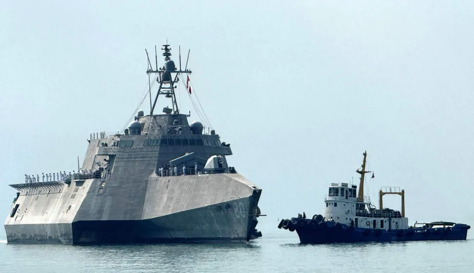 The US Navy's USS Cincinnati (LCS-20) littoral combat ship (L) arrives for a port call at the Ream Naval base, located in Cambodia's southern coast in Preah Sihanouk province, on January 24, 2026. (Photo by Suy SE/AFP)