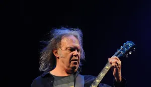File photo dated 26/06/09 of Neil Young performing on the Pyramid Stage during the 2009 Glastonbury Festival at Worthy Farm in Pilton, Somerset. The Canadian-born singer-songwriter, 79, has announced he will not be playing at Glastonbury Festival this year as he believes the music event is "now under corporate control" of the BBC. Issue date: Thursday January 2, 2025. Photo: Anthony Devlin/PRESS ASSOCIATION