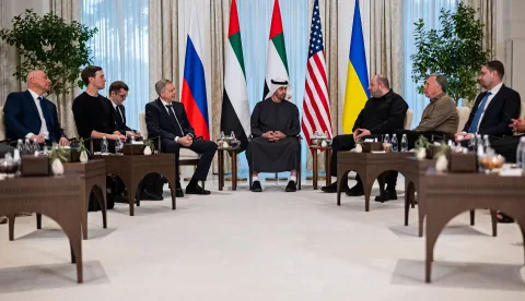 This handout photograph taken and released by the UAE Presidential Court on January 23, 2026 shows UAE President Sheikh Mohamed bin Zayed al-Nahyan (C) speaking with the heads of delegations participating in the UAE-hosted trilateral talks between the US, Russia and Ukraine, at the Al Shati Palace in Abu Dhabi. Three-way talks between Russia, Ukraine and the US opened in Abu Dhabi, the UAE said on January 23, as Moscow said it was not dropping its demand that Kyiv pull out of its eastern Donbas region. (Photo by UAE PRESIDENTIAL COURT/AFP)/RESTRICTED TO EDITORIAL USE - MANDATORY CREDIT "AFP PHOTO/UAE Presidential Court" - HANDOUT - NO MARKETING NO ADVERTISING CAMPAIGNS - DISTRIBUTED AS A SERVICE TO CLIENTS