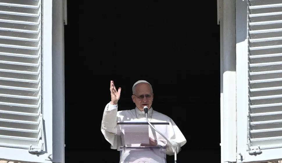 Pope Leo XIV delivers his speech from the window of the apostolic palace overlooking St. Peter's square during the Angelus prayer in the Vatican on January 25, 2026. (Photo by Andreas SOLARO/AFP)