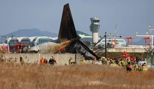 epaselect epa11796608 Firefighters carry out rescue operations at Muan International Airport in Muan, 288 kilometers southwest of Seoul, South Korea, 29 December 2024, after a passenger plane with 181 people aboard crashed. According to Yonhap New Agency, at least 28 people died after the Jeju Air passenger plane crashed during landing. The flight was inbound from Bangkok, Thailand. EPA/YONHAP SOUTH KOREA OUT
