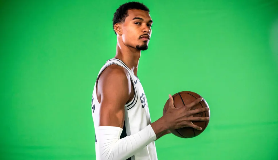 (FILES) French basketball player Victor Wembanyama poses for promotional photos during the San Antonio Spurs media day at the Victory Capital Performance Center in San Antonio, Texas on September 29, 2025. San Antonio Spurs superstar Victor Wembanyama said on January 27, 2026, he was "horrified" by unrest in Minneapolis, where two civilians have been shot dead by federal agents during the Trump administration's immigration crackdown. (Photo by SERGIO FLORES/AFP)