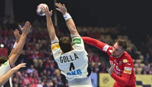 Germany's pivot #04 Johannes Golla and Croatia's centre back #41 Tin Lucin vie for the ball during the men's EHF Euro 2026 semi-finals handball match Germany vs Croatia in Herning, Denmark, on January 30, 2026. (Photo by Jonathan Nackstrand/AFP)