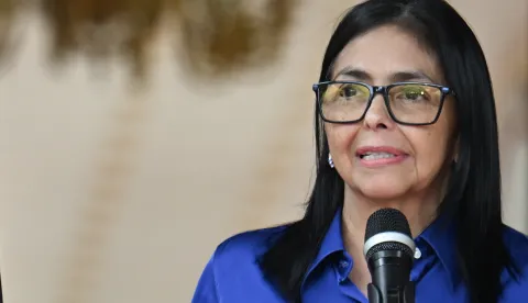 (FILES) Venezuela's interim President Delcy Rodriguez speaks during a press conference at the Miraflores Presidential Palace in Caracas on January 14, 2026. Venezuela's interim president Delcy Rodriguez forecast a .4 billion bonanza from planned reforms to the oil sector aimed at drawing in foreign investors following the ouster of Nicolas Maduro. During a meeting with business leaders attended by AFP on January 26, 2026, Rodriguez projected investments in the oil sector would rise 55 percent over 2025, when they totaled 0 million. (Photo by Juan BARRETO/AFP)