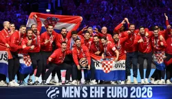 Croatia's players celebrate with the trophy during the awarding ceremony after the team won bronze in the Men's EHF Euro 2026 finals in Herning, Denmark, on February 1, 2026. (Photo by Jonathan Nackstrand/AFP)