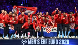 Croatia's players celebrate with the trophy during the awarding ceremony after the team won bronze in the Men's EHF Euro 2026 finals in Herning, Denmark, on February 1, 2026. (Photo by Jonathan Nackstrand/AFP)
