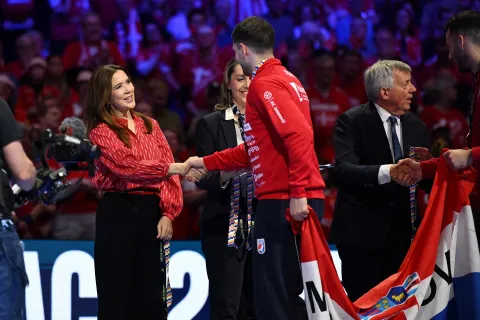 Queen Mary of Denmark (L) shakes hands with Croatia's players during the awarding ceremony after the team won bronze in the Men's EHF Euro 2026 finals in Herning, Denmark, on February 1, 2026. (Photo by Jonathan Nackstrand/AFP)