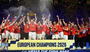 Denmark's team celebrates with the trophy after winning the Men's EHF Euro 2026 final handball match Denmark vs Germany in Herning, Denmark, on February 1, 2026. (Photo by Jonathan Nackstrand/AFP)