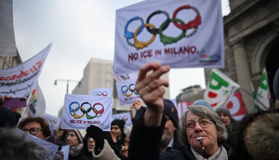People take part in a demonstration against US Immigration and Customs Enforcement (ICE) ahead of the Milano Cortina 2026 Olympic Games in Milan, northern Italy, on January 31, 2026. A branch of the US Immigration and Customs Enforcement (ICE) will help support security operations for the Winter Olympics in Italy, sparking consternation and warnings they were not welcome. (Photo by Piero CRUCIATTI/AFP)