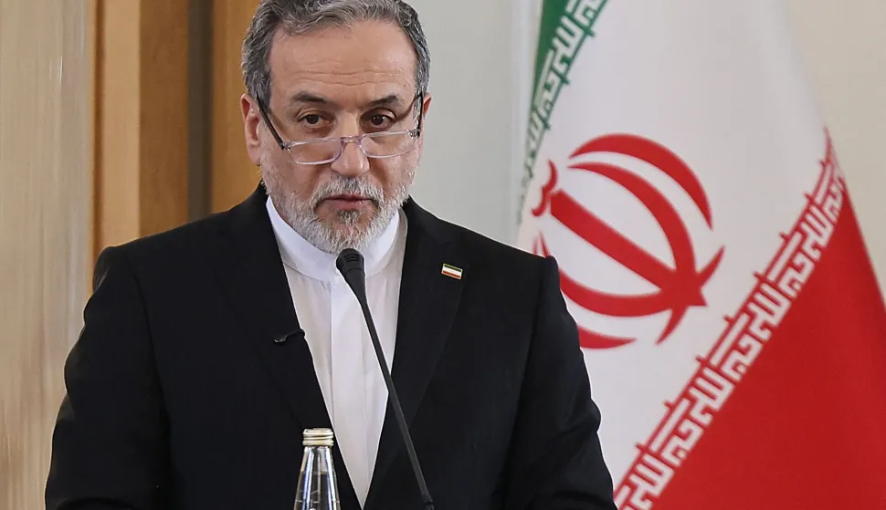(FILES) Iranian Foreign Minister Abbas Araghchi attends a joint press conference with his Iraqi counterpart Fuad Hussein, in Tehran on January 18, 2026. EU terrorist designation of Iran Guards a 'major strategic mistake', Iran foreign minister said on January 29, 2026. (Photo by ATTA KENARE/AFP)