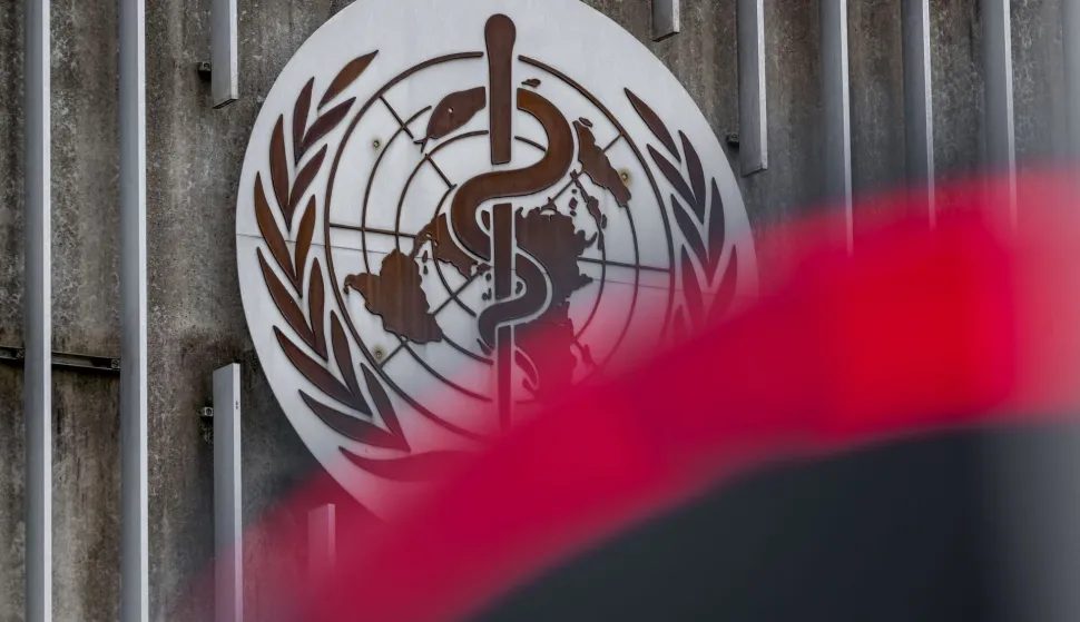 (FILES) This photograph taken on April 23, 2025 shows a logo of the World Health Organisation (WHO) next to their headquarters in Geneva. The World Health Organization chief warned on January 13, 2026, that the Trump administration's decision to withdraw from the UN health agency was dangerous for the United States and the rest of the world alike. (Photo by Fabrice COFFRINI/AFP)