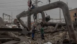 Employees repair sections of the Darnytska combined heat and power plant damaged by Russian air strikes in Kyiv, on February 4, 2026, amid the Russian invasion of Ukraine. Recent Russian strikes on Ukraine's power infrastructure have disrupted light, heating and water supplies to millions across the country as temperatures plummet well below freezing, leaving the war-battered country facing a fresh humanitarian crisis. (Photo by Roman PILIPEY/AFP)