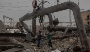 Employees repair sections of the Darnytska combined heat and power plant damaged by Russian air strikes in Kyiv, on February 4, 2026, amid the Russian invasion of Ukraine. Recent Russian strikes on Ukraine's power infrastructure have disrupted light, heating and water supplies to millions across the country as temperatures plummet well below freezing, leaving the war-battered country facing a fresh humanitarian crisis. (Photo by Roman PILIPEY/AFP)