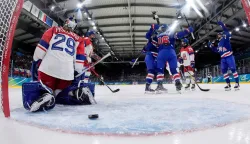 US' forward #16 Hayley Scamurra celebrates with teammates after scoring her team's fifth goal past Czech Republic's goalkeeper #29 Klara Peslarova during the women's preliminary round Group A Ice Hockey match between USA and Czech Republic at the Milano Rho Ice Hockey Arena during the Milano Cortina 2026 Winter Olympic Games in Milan, on February 5, 2026. (Photo by POOL/AFP)