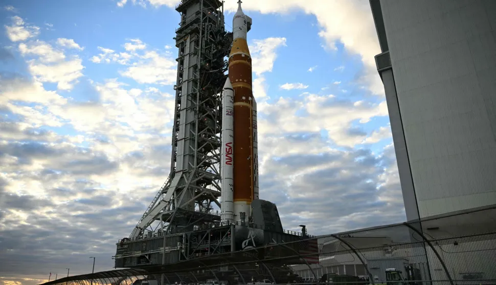 NASA's Artemis II Space Launch System rocket and Orion spacecraft are rolled out of the Vehicle Assembly Building to Launch Pad 39B at Kennedy Space Center in Florida on January 17, 2026, ahead of the crewed lunar mission. (Photo by Jim WATSON/AFP)