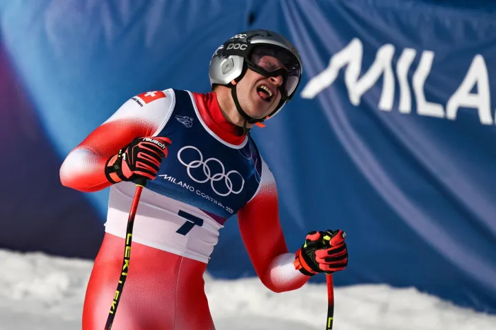 Switzerland's Marco Odermatt reacts in the finish area after competing in the men's downhill alpine skiing event during the Milano Cortina 2026 Winter Olympic Games at the Stelvio Ski Centre in Bormio (Valtellina) on February 7, 2026. (Photo by Jeff PACHOUD/AFP)