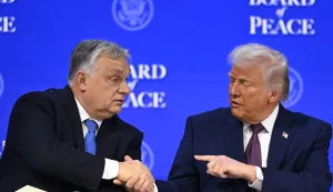 Hungary's Prime Minister Viktor Orban (L) shakes hands with US President Donald Trump (C) at the "Board of Peace" meeting during the World Economic Forum (WEF) annual meeting in Davos on January 22, 2026. US President Donald Trump will show off his new "Board of Peace" at Davos on January 22, 2026 burnishing his claim to be a peacemaker a day after backing off his own threats against Greenland. Originally meant to oversee the rebuilding of Gaza after the war between Hamas and Israel, the board's charter does not limit its role to the Strip, and has sparked concerns that Trump wants it to rival the United Nations. (Photo by Fabrice COFFRINI/AFP)