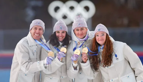 Gold medallists France's Eric Perrot, France's Quentin Fillon Maillet, France's Lou Jeanmonnot, France's Julia Simon pose with their medals on the podium of the mixed biathlon 4 x 6km relay event during the Milano Cortina 2026 Winter Olympic Games at the Anterselva Biathlon Arena (Sudtirol Arena) in Anterselva (Val Pusteria) on February 8, 2026. (Photo by FRANCK FIFE/AFP)
