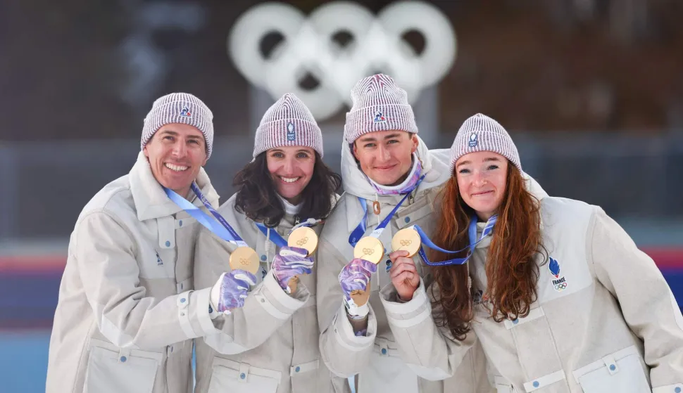Gold medallists France's Eric Perrot, France's Quentin Fillon Maillet, France's Lou Jeanmonnot, France's Julia Simon pose with their medals on the podium of the mixed biathlon 4 x 6km relay event during the Milano Cortina 2026 Winter Olympic Games at the Anterselva Biathlon Arena (Sudtirol Arena) in Anterselva (Val Pusteria) on February 8, 2026. (Photo by FRANCK FIFE/AFP)