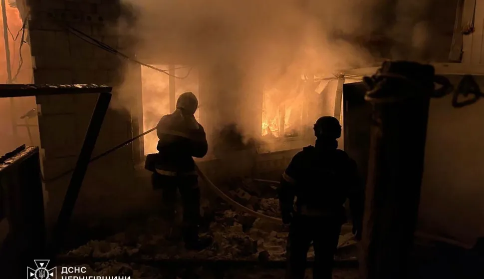 This handout photograph taken and released by the State Emergency Service of Ukraine on February 9, 2026, shows firefighters as they work to extinguish a fire at a private house following a Russian drone attack in Novhorod-Sivers'kyi, Chernihiv region, amid the Russian invasion of Ukraine. (Photo by Handout/Ukrainian State Emergency Service/AFP)/RESTRICTED TO EDITORIAL USE - MANDATORY CREDIT "AFP PHOTO/HANDOUT/Ukrainian State Emergency Service " - HANDOUT - NO MARKETING NO ADVERTISING CAMPAIGNS - DISTRIBUTED AS A SERVICE TO CLIENTS - AFP CANNOT INDEPENDENTLY VERIFY THE AUTHENTICITY OR LOCATION, DATE, AND CONTENT OF THESE IMAGES./