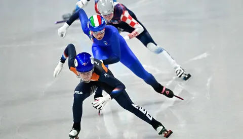 Netherlands' Xandra Velzeboer, Italy's Chiara Betti and Croatia's Valentina Ascic compete in the short track speed skating women's 500m heats during the Milano Cortina 2026 Winter Olympic Games at Milano Ice Skating Arena in Milan on February 10, 2026. (Photo by JULIEN DE ROSA/AFP)