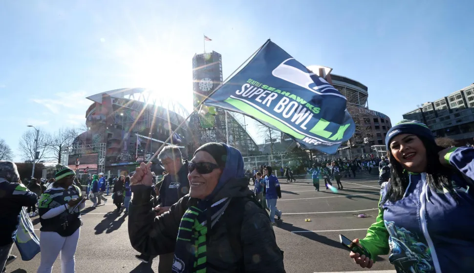 SEATTLE, WASHINGTON - FEBRUARY 11: Fans celebrate during the Seattle Seahawks Super Bowl LX victory celebration and parade at Lumen Field on February 11, 2026 in Seattle, Washington. Steph Chambers/Getty Images/AFP (Photo by Steph Chambers/GETTY IMAGES NORTH AMERICA/Getty Images via AFP)