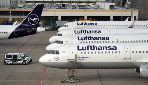 epa10153963 Airplanes of German airline Lufthansa parked at the international airport in Frankfurt am Main, Germany, 02 September 2022. The pilots of Germany's flag carrier Lufthansa and Lufthansa Cargo called for a 24-hour strike on 02 September after failed pay talks with the company. Lufthansa announced on 01 September that around 800 flights would be canceled, affecting more than 130,000 passengers. EPA/RONALD WITTEK