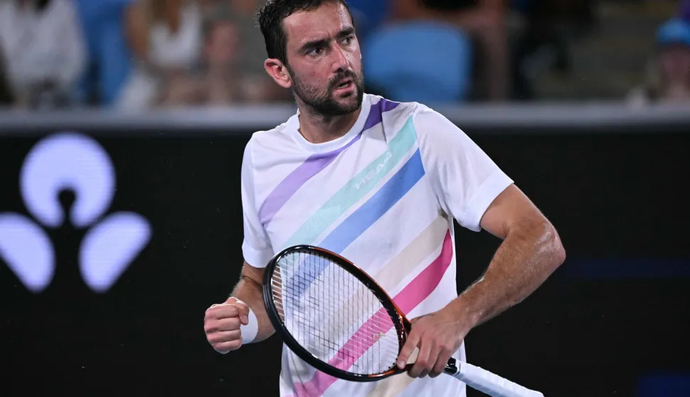 Croatia?s Marin Cilic reacts after a point against Norway's Casper Ruud during their men's singles match on day seven of the Australian Open tennis tournament in Melbourne on January 24, 2026. (Photo by WILLIAM WEST/AFP)/-- IMAGE RESTRICTED TO EDITORIAL USE - STRICTLY NO COMMERCIAL USE --