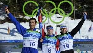 (FILES) Russia's gold medalist Evgeny Ustyugov (C), France's silver medalist Martin Fourcade (L) and Slovakia's bronze medalist Pavol Hurajt stand on the podium after the men's Biathlon 15 km mass start final at the Whistler Olympic Park during the Vancouver Winter Olympics on February 21, 2010. (Photo by Franck FIFE/AFP)