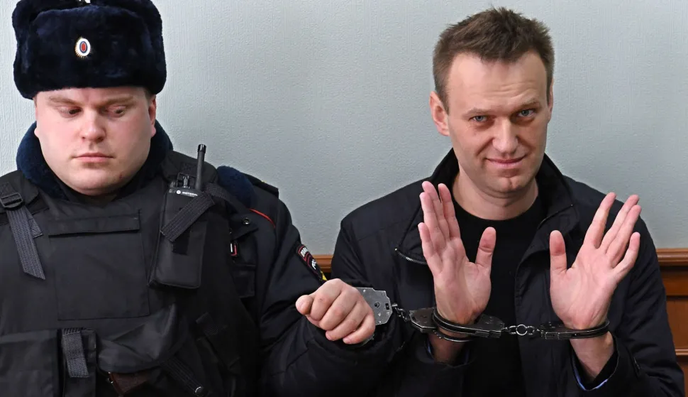 (FILES) Kremlin critic Alexei Navalny, who was arrested during March 26, 2017 anti-corruption rally, gestures during an appeal hearing at a court in Moscow on March 30, 2017. The "murder" of late Russian opposition politician Alexei Navalny in an Arctic prison in 2024 is now a "science-proven fact", his widow Yulia Navalnaya said on February 14, 2026 after five European countries said Moscow used a lethal toxic on the Kremlin opponent. (Photo by Kirill KUDRYAVTSEV/AFP)
