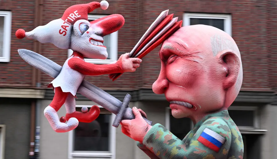 A carnival float designed by German carnival float builder Jacques Tilly featuring Russian President Vladimir Putin is pictured during the parade to celebrate Rose Monday (Rosenmontag), on February 16, 2026 in Duesseldorf, western Germany. (Photo by INA FASSBENDER/AFP)