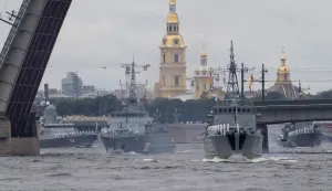 epa09364348 Russian Navy warships take part in the 'Russia Navy Day' parade with the Liteiny bridge and Peter and Paul Cathedral seen in the background, in St. Petersburg, Russia, 25 July 2021. The Russian Navy celebrates 325 years of its foundation by Tsar Peter the Great. EPA/ANATOLY MALTSEV