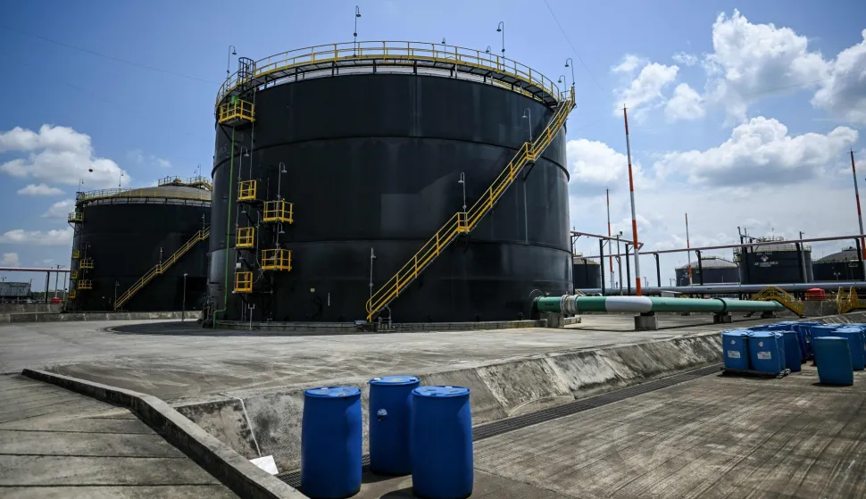 (FILES) Picture of crude oil storage tanks at the plant of Colombian petroleum company Ecopetrol in Acacias, Meta Department, south of Bogota on February 10, 2023. Ecuador increased the tariff for transporting Colombian oil through its pipeline by 900%, from three to 30 dollars, announced Daniel Noboa's government on January 26, 2026, amid a tariff war. (Photo by Juan BARRETO/AFP)