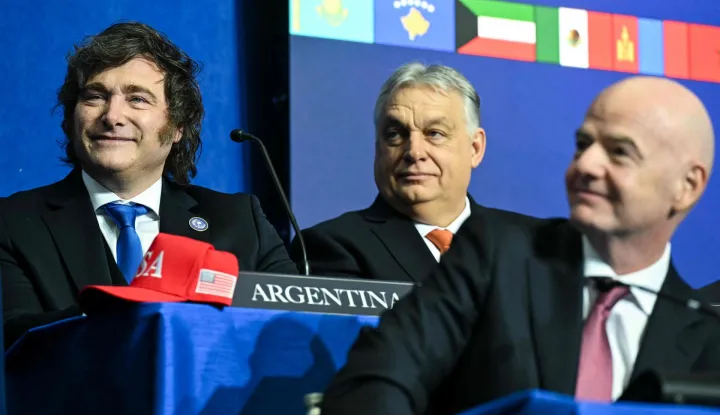 (L/R) Argentina's President Javier Milei, Hungary's Prime Minister Viktor Orban, and FIFA President Gianni Infantino attend the inaugural meeting of the "Board of Peace" hosted by US President Donald Trump at the US Institute of Peace in Washington, DC, on February 19, 2026. President Trump on Thursday gathers allies to inaugurate the "Board of Peace," his new institution focused on progress on Gaza but whose ambitions reach much further. Around two dozen world leaders or other senior officials have come to Washington for the meeting -- including several of Trump's authoritarian-leaning friends and virtually none of the European democrats that traditionally sign on to US initiatives. (Photo by SAUL LOEB/AFP)