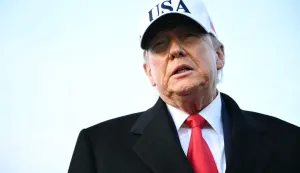 US President Donald Trump speaks to the press upon returning to Joint Base Andrews in Maryland on January 13, 2026. Trump is returning from speaking to The Detroit Economic Club in Detroit, Michigan, and a visit to a Ford production plant. (Photo by Mandel NGAN/AFP)