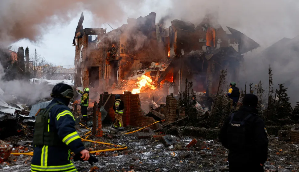 Firefighters work at the site of a residential building damaged during Russian drone and missile strikes, amid Russia's attack on Ukraine, in Kyiv, Ukraine, February 22, 2026. REUTERS/Alina Smutko  TPX IMAGES OF THE DAY Photo: ALINA SMUTKO/REUTERS