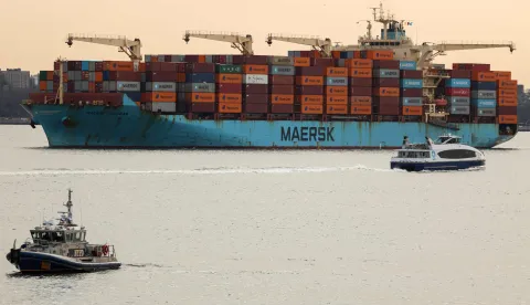 (FILES) A Maersk cargo ship loaded with shipping containers navigates through New York Bay on January 23, 2026. The US Supreme Court ruled February 20, that Donald Trump exceeded his authority in imposing a swath of tariffs that upended global trade, blocking a key tool the president has wielded to impose his economic agenda. (Photo by CHARLY TRIBALLEAU/AFP)
