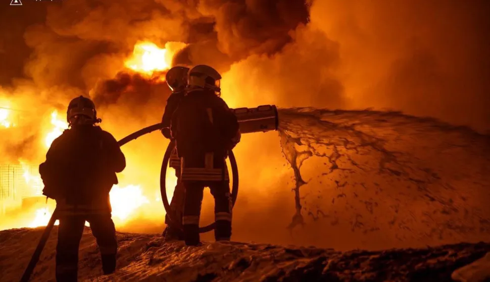 This photograph taken and released by Ukrainian Emergency Services on February 15, 2026 shows firefighters extinguishing a fire after a Russian drone strike in Odessa, amid the Russian invasion of Ukraine. (Photo by Handout/UKRAINIAN EMERGENCY SERVICE/AFP)