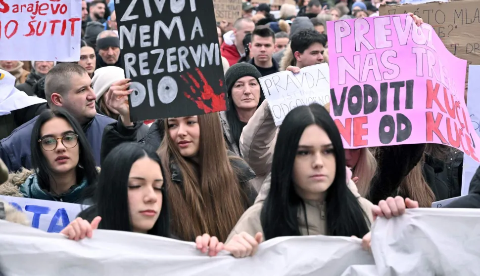 Protesters hold banners and placards during a rally after Erdoan Moranjkic has been killed in a deadly streetcar accident, in Sarajevo on February 21, 2026. Several thousand people marched in Sarajevo on on February 21, 2026 to demand ?justice? after a recent tram accident in the Bosnian capital in which a student was killed and a high school girl seriously injured, an AFP photographer reported. The accident fueled anger among young people, students, and high schoolers, who began gathering the next day, initially to express their solidarity and demand a swift investigation. (Photo by ELVIS BARUKCIC/AFP)