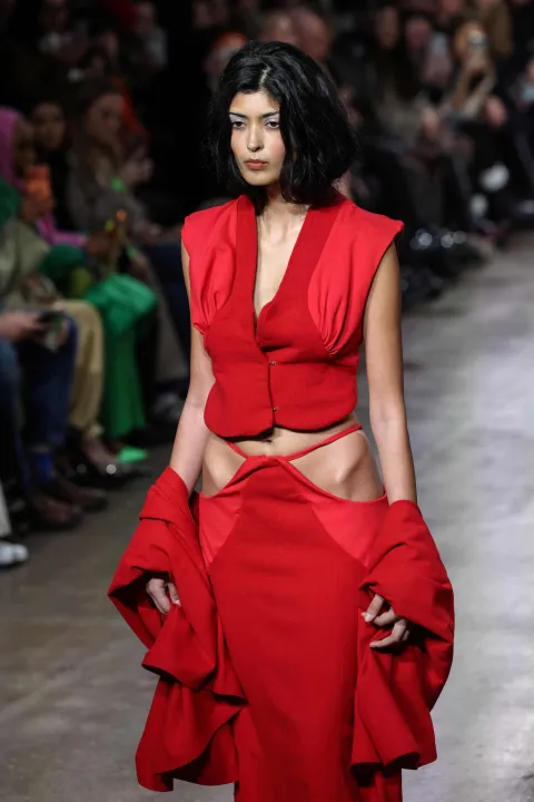 A model presents a creation from the Autumn-Winter 2026-2027 collection 'The Sovereignty Of Stillness' from Britain-based womenswear designer Naomi Hart at London Fashion Week at Fashion Scout, in London on February 22, 2026. (Photo by Toby Shepheard/AFP)