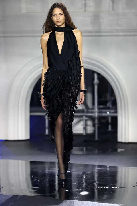 A model presents a creation during a catwalk presentation for Burberry's Autumn/Winter 2026 collection, during London Fashion Week in London on February 23, 2026. (Photo by Toby Shepheard/AFP)