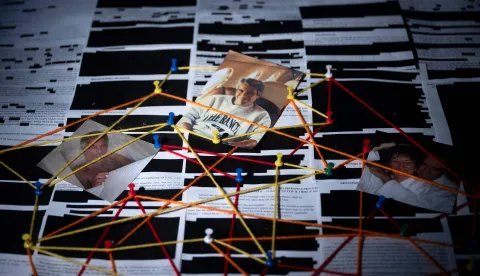 This photo illustration shows redacted documents from the Epstein Library files released by the US Department of Justice in Washington, DC, on February 18, 2026. The Epstein Files Transparency Act (EFTA), passed overwhelmingly by Congress in November 2025, compelled the Justice Department to release all of the documents in its possession related to the disgraced financier Jeffrey Epstein within 30 days. (Photo by Brendan Smialowski/AFP)/-- IMAGE RESTRICTED TO EDITORIAL USE - STRICTLY NO COMMERCIAL USE --