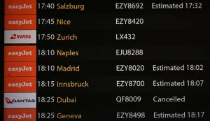 The arrivals board is seen, showing a cancelled flight from Dubai, in the north terminal at London Gatwick airport in Crawley, on February 28, 2026, following the US and Israel's strikes on Iran. Flights across the Middle East were being cancelled Saturday as several countries slammed their airspace shut after the United States and Israel launched strikes on Iran. (Photo by Ben Stansall/AFP)