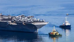 The US Navy aircraft carrier USS Gerald R. Ford departs Souda Bay on the island of Crete on February 26, 2026. (Photo by Costas METAXAKIS/AFP)