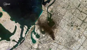 This handout satellite image taken by 2026 Planet Labs PBC on March 1, 2026 shows a smoke plume billowing in Dubai after a projectile strike. Residents of Dubai were aghast as hundreds of drones and missiles targeted the United Arab Emirates and the US' other Gulf allies, long-time refuges from regional conflict, on February 28 and March 1 in the wake of the war that started on February 28 with US and Israeli strikes on Iran. (Photo by AFP)/RESTRICTED TO EDITORIAL USE - MANDATORY CREDIT "AFP PHOTO/&Atilde;&fnof;&acirc;&euro;&scaron;&Atilde;'&Acirc;&copy; 2026 PLANET LABS PBC " - HANDOUT - NO MARKETING NO ADVERTISING CAMPAIGNS - DISTRIBUTED AS A SERVICE TO CLIENTS