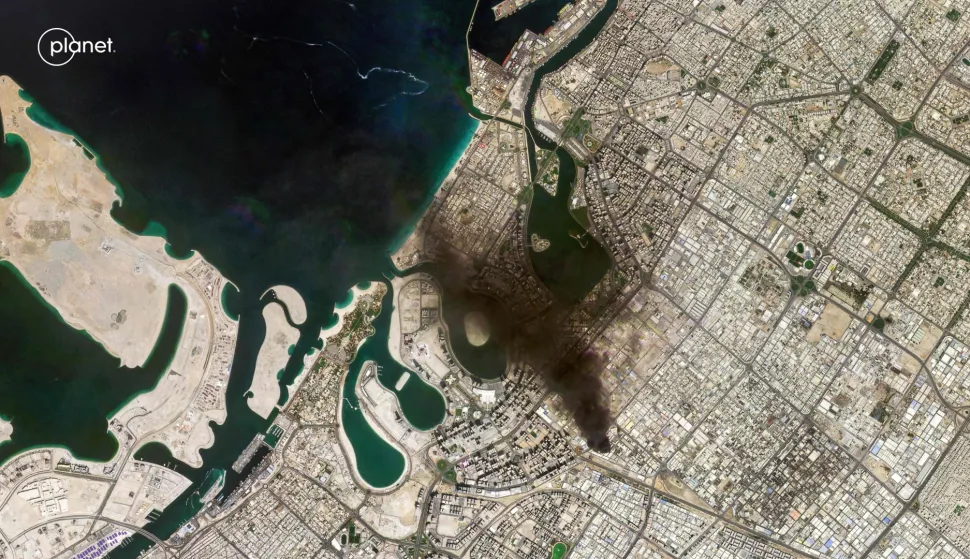 This handout satellite image taken by 2026 Planet Labs PBC on March 1, 2026 shows a smoke plume billowing in Dubai after a projectile strike. Residents of Dubai were aghast as hundreds of drones and missiles targeted the United Arab Emirates and the US' other Gulf allies, long-time refuges from regional conflict, on February 28 and March 1 in the wake of the war that started on February 28 with US and Israeli strikes on Iran. (Photo by AFP)/RESTRICTED TO EDITORIAL USE - MANDATORY CREDIT "AFP PHOTO/&Atilde;&fnof;&acirc;&euro;&scaron;&Atilde;'&Acirc;&copy; 2026 PLANET LABS PBC " - HANDOUT - NO MARKETING NO ADVERTISING CAMPAIGNS - DISTRIBUTED AS A SERVICE TO CLIENTS