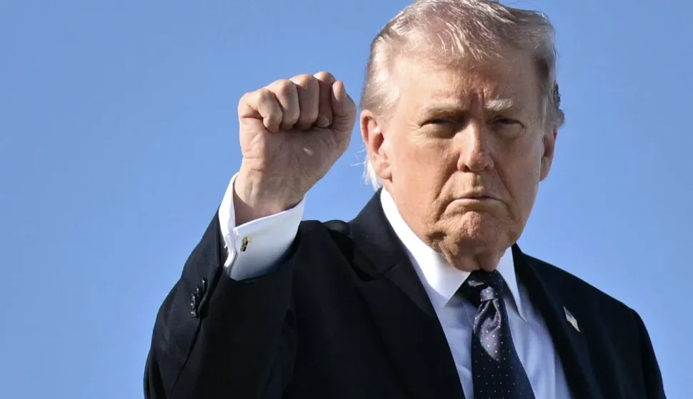 US President Donald Trump gestures as he boards Air Force One before departing Palm Beach International Airport in West Palm Beach, Florida, on March 1, 2026, on his way back to Washington, DC. The United States and Israel launched massive bombardments against Iran and killed its supreme leader on February 28, with attacks ongoing Sunday. The US military on Sunday said three service members have been killed and five seriously wounded in the war against Iran -- the first casualties announced on the US side. (Photo by Mandel NGAN/AFP)