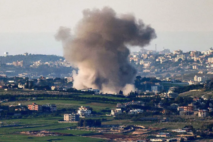 Smoke rises from an explosion following Israeli bombardment on southern Lebanon near the border with northern Israel on March 2, 2026. The war launched by the United States and Israel against Iran spread across the Middle East on March 2 with Lebanon's Hezbollah entering the fray and a British air base in Cyprus targeted. (Photo by Jalaa MAREY/AFP)